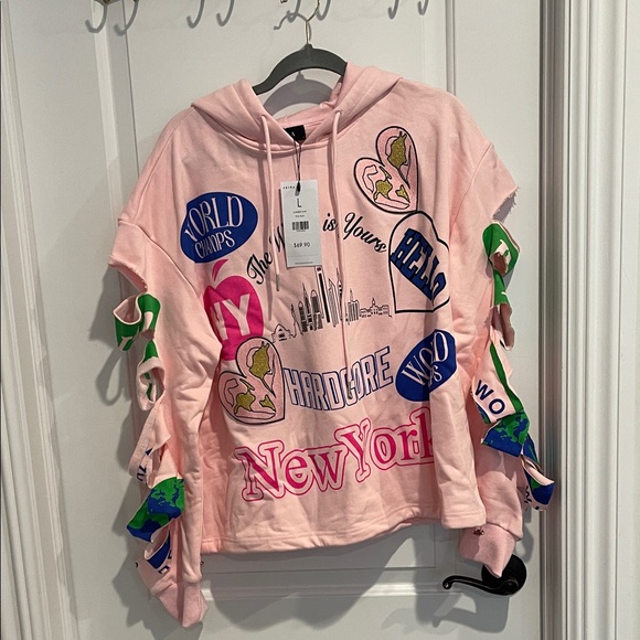 AKIRA Tops - AKIRA Light Pink Hoodie with NYC logos patches, all over so cute